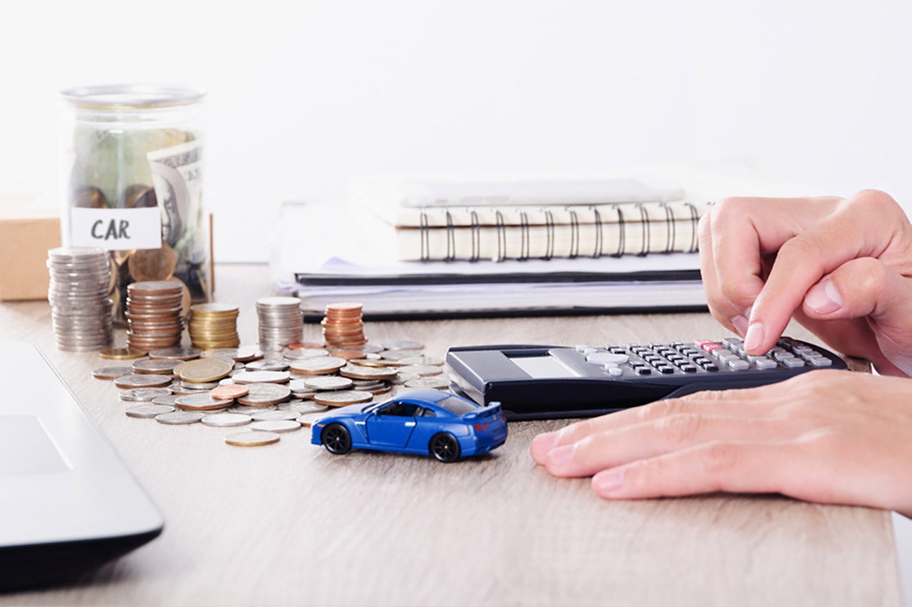 Calculating used car payments near a blue toy car